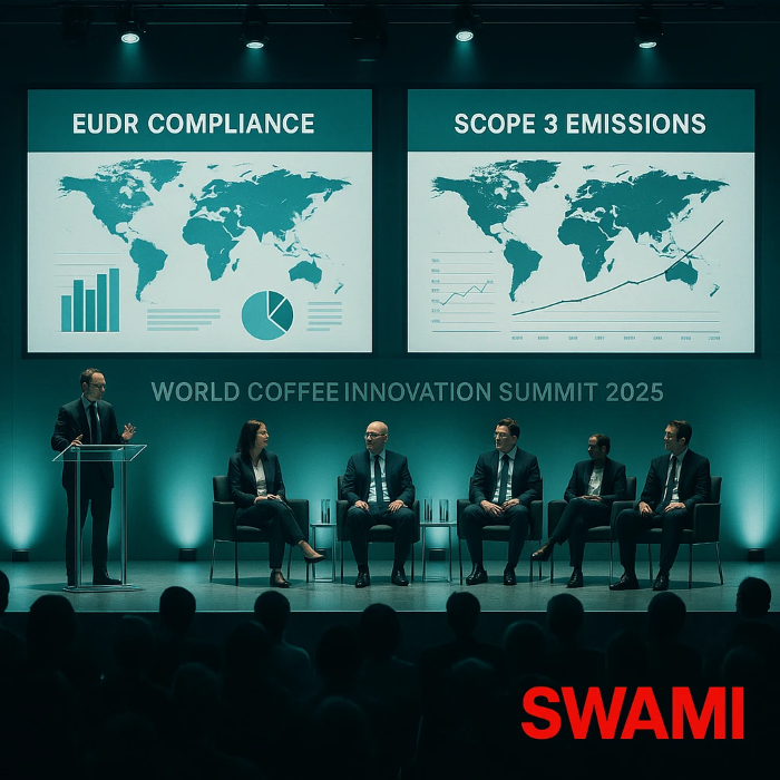  Cinematic high‑angle wide shot of a London conference panel at the World Coffee Innovation Summit 2025; large screens show “EUDR Compliance” and “Scope 3 Emissions” dashboards (charts, maps). Modern professional lighting with soft teal and deep charcoal grey palette; audience silhouettes; subtle reflections on glass podiums. SWAMI watermark in red (#D0021B) bottom right.