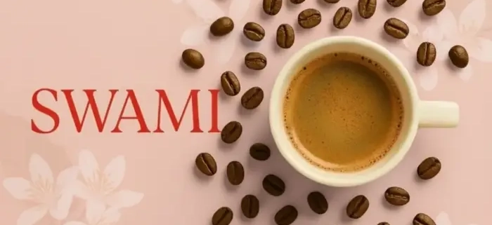 کاپ اسپرسو با دانه‌های قهوه پیرامون آن و لوگوی قرمز SWAMI